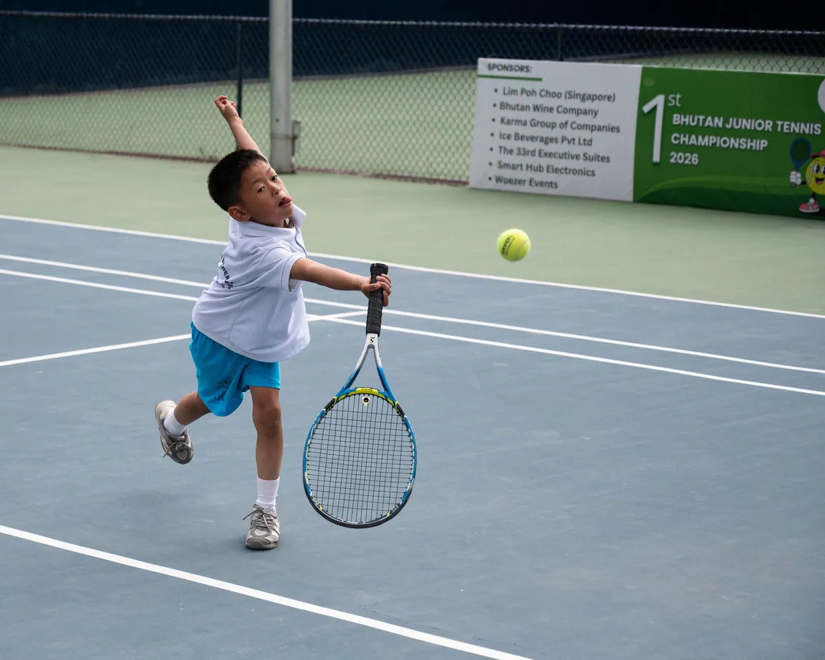 One of the youngest players reaching up to hit an overhead