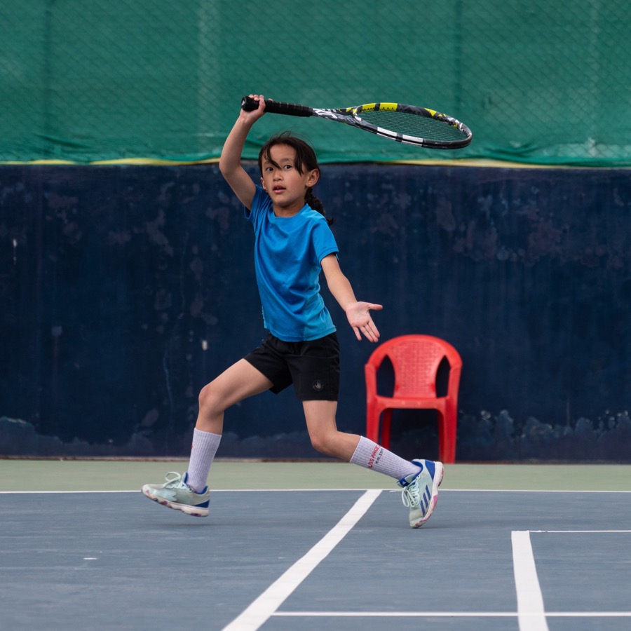 Placeholder portrait of a junior player hitting a forehand
